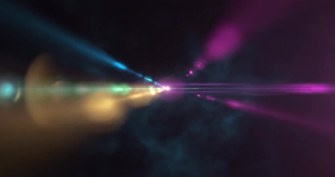 Abstract light rays and colorful flares illuminating a dark background, creating a vibrant atmosphere