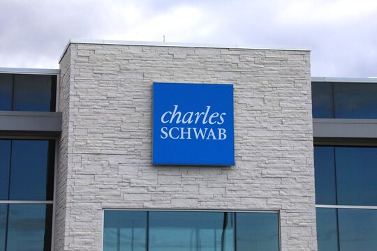 Charles Schwab financial services storefront Sign and Logo.