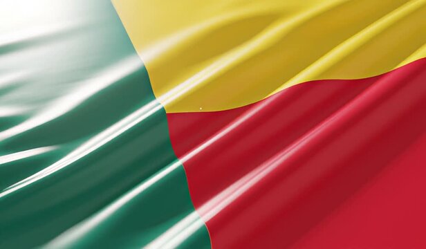 Close-up view of the national flag of Benin, featuring its vibrant green, yellow, and red colors waving gently.