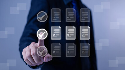 Business checklist concept with hand pressing digital check mark on virtual documents interface. Quality control, approval process, audit, compliance, workflow management 