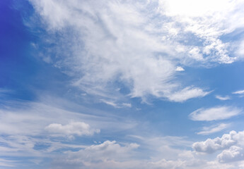 Obraz premium clear blue sky background,clouds with background, Blue sky background with tiny clouds. White fluffy clouds in the blue sky. 