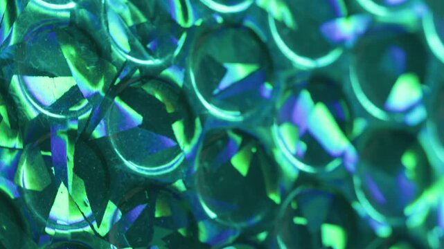 Shiny bubbles art. Rainbow light. Blur purple blue green colorful round radiant gleam leak on abstract illuminated uneven background.