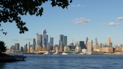 Obraz premium New York City Manhattan Midtown skyline, Chelsea and Hudson Yards towers from New Jersey, Hoboken pier, United States. River waterfront urban cityscape with skyscraper buildings, American architecture