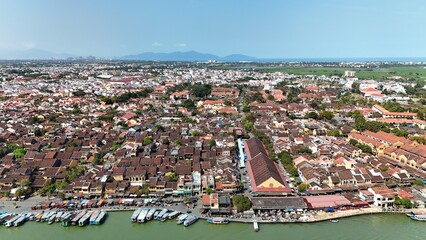Hoi An (Hoian), Da Nang City (Quang Nam), Vietnam: 4K aerial view of ancient town, UNESCO heritage, Hoai river, boats, lantern streets and historic waterfront. © Thomas