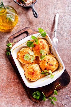 baked chicken cutlets in white bowl