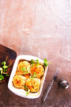 baked chicken cutlets in white bowl