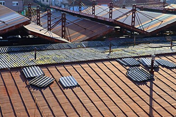 Naklejka premium Top view of old rusty metal roofs