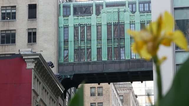 New York City Gimbels bridge, Manhattan Midtown, United States of America. Skybridge on Broadway, Herald Square, USA. Gimbels traverse on 6 avenue. Historic elevated walkway 1925, copper green patina.