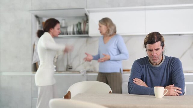 Man was sad because women were arguing in his presence in kitchen