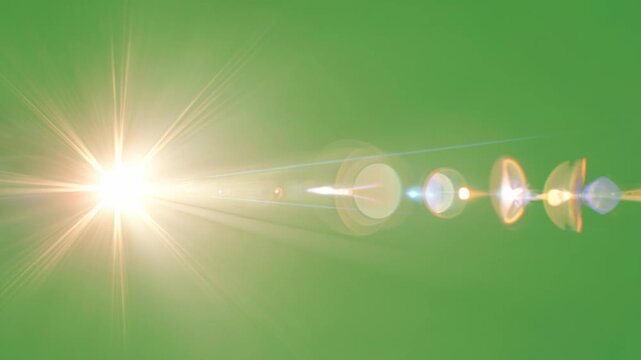 Golden digital lens flare with a sharp starburst and horizontal anamorphic light streaks on a green chroma key background for cinematic video editing and VFX compositing.