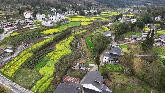 A cinematic drone flight over a colorful mountain village, showcasing the beauty of China's hidden rural gems in springtime.