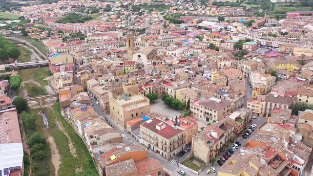 Summer view from drone of center of medieval Spanish town of La Bisbal d Emporda with episcopal palace castle and Church of Santa Maria, province of Girona, Catalonia