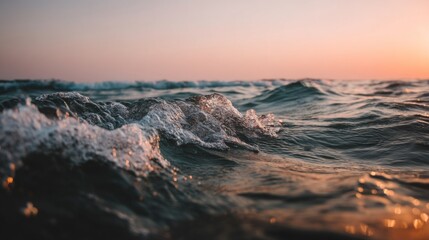 Fototapeta premium Captivating Ocean Waves at Sunset Captured with Soft Light and Gentle Ripples in Calm Sea Leaving Traces on the Shoreline at Dusk