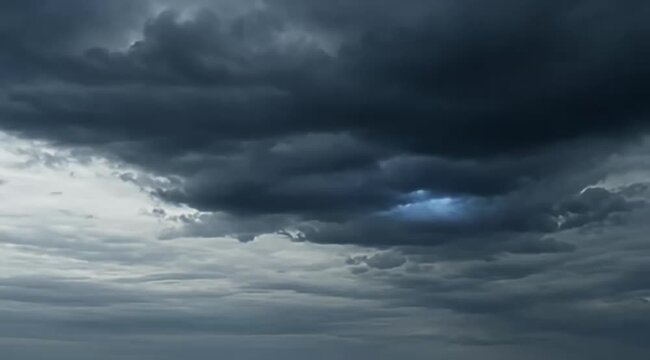 Dramatic storm clouds, dark grey thundercloud sky, cinematic moody weather background