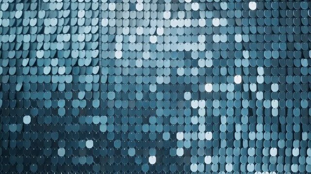 A close-up view of a textured wall made of shimmering blue sequins.