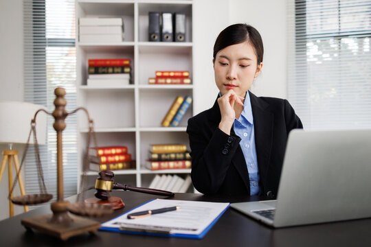 Female lawyer thinking while working in legal office