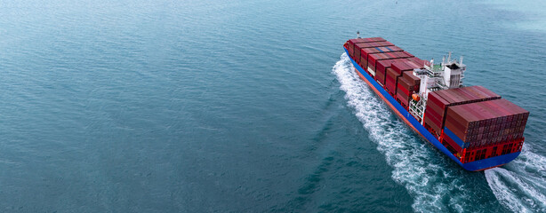 Naklejka na ściany i meble Aerial view container cargo ship carrier container on sea, Global business logistics transportation by container cargo ship, Container cargo ship freight shipping import export supply chain.