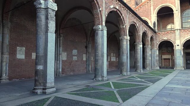 Panning view of the Basilica of Saint Ambrogio. It is recalls the paleochristian and medieval periods. It stands in Piazza Saint Ambrogio, in the heart of the city of Milan.Italy