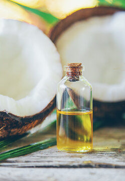 Natural coconut oil in a bottle. Selective focus.