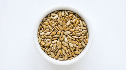 Fototapeta premium A white bowl filled with sunflower seeds on a plain background