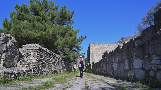 Woman Walking Through Ancient Ruins in Kos, Greece