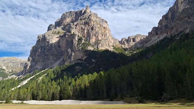 The winding Vallunga hiking trail among the rocks in the Puez Geisler nature park in Selva. Panorama.