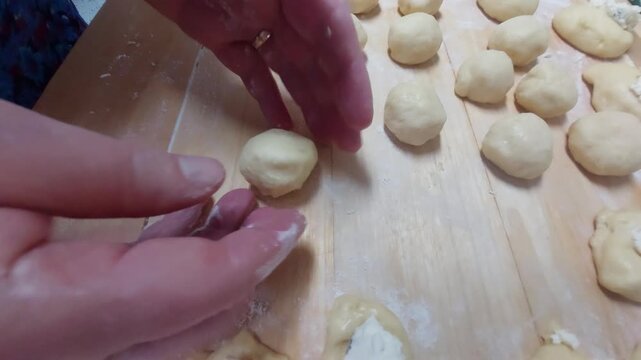 Hand Wrapping Curd Filling into Yeast Dough for Moravian Cakes 