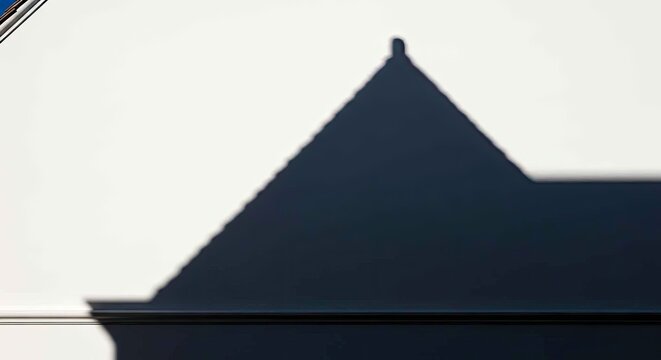 Minimalist Shadow Roof Silhouette on White Wall High Contrast Architectural Photography for Modern Branding