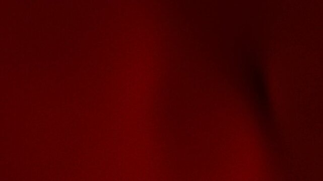 Abstract blurred dark red background with subtle shadow details. Great for website banners, social media posts, and digital graphic designs.