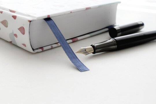 old book and pen