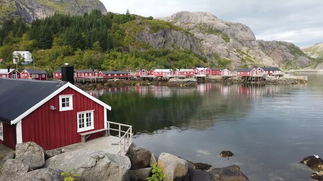 Traditional red rorbuer in hamnoy fishing village, lofoten islands
