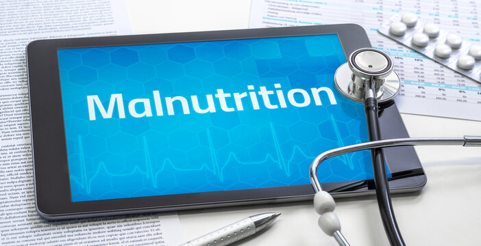 A tablet with the word Malnutrition on the display