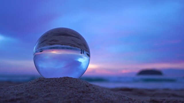 amazing view of the sea and sky in beautiful sunset are unconventional and beautiful inside crystal ball. 
A image for a unique and creative travel. 4K Videos for beautiful and unusual travel ideas.