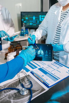 Medical team working on digital tablet healthcare doctor technology tablet use computer analyzed the results using data and technology for prediction and prevention.