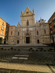 Fototapeta premium Vertical view of Errico Alvino neo-Gothic masterwork: triple salients portals, trifore/bifore windows, cuspidi spires on Latin cross basilica.