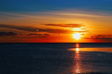 Fototapeta premium Sunset over the Waters of Manado Bay