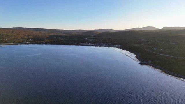Aerial drone flying back toward Olderfjord coast Norway