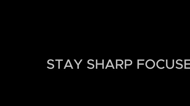 Typography displays the motivational phrase stay sharp focused against a dark black background setting.