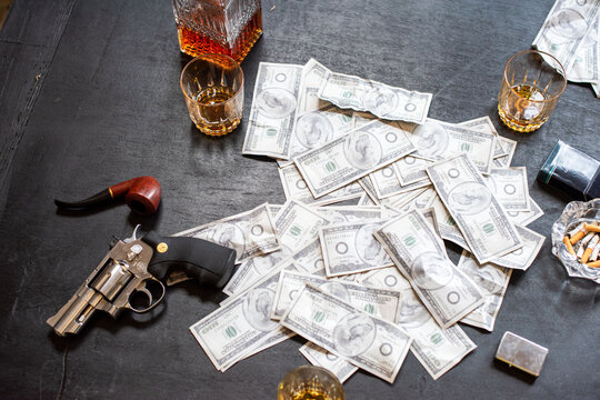 Cash, whiskey, gun, pipe, table