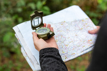 Naklejka premium Navigation outdoors with map compass