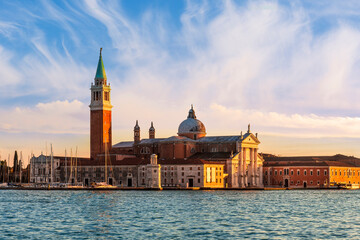 beautiful view at Abbey of San Giorgio Maggiore from San Marco square in Venice, Italy. Venetian sunset landscape of antique architecture. © Yaroslav