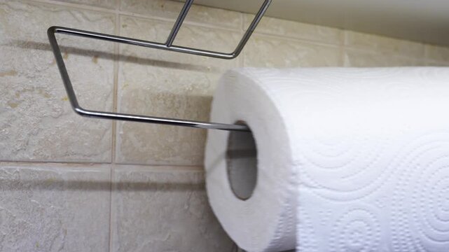 How to replace a paper towel roll in a kitchen or bathroom holder in a few simple steps