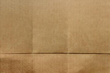 Fototapeta premium Textured brown cardboard background with copy space