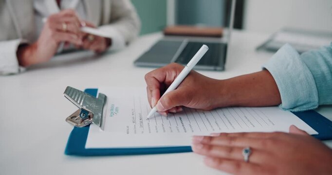 Patient filling medical form during consultation, healthcare paperwork and clinic registration concept.