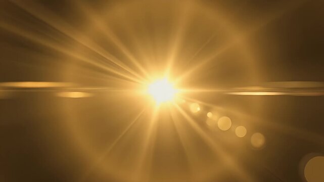 Abstract golden light lens flare with starburst effect