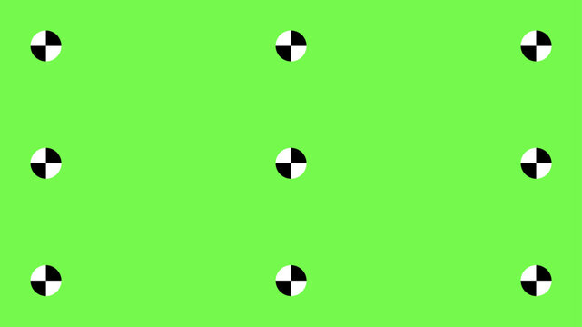 Professional greenscreen setup with tracking points and motion markers for seamless chroma key compositing in cinema and television post-production