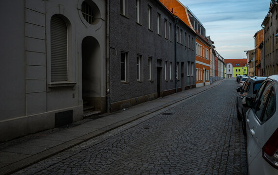 Quiet residential street with colorful historic buildings in Finsterwalde, Brandenburg, Germany