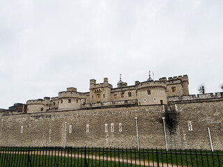 Historic Tower of London stone fortress and fortified walls overlooking the moat in London, UK © AS Photo Family
