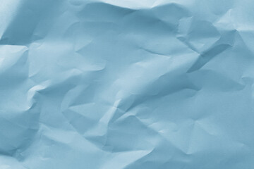 Obraz premium Textured blue crumpled paper background