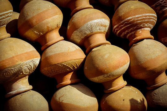 Rows of decorated terracotta clay pots at a market, New Delhi, India 